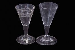 Two 18th century glasses one with folded foot and engraved design of flowers, with round bowl, (