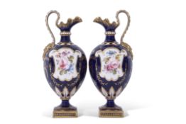 Fine pair of Royal Crown Derby ewers, the blue ground with gilt floral designs with two reserves