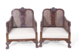 Late 19th/early 20th century mahogany Bergere suite, comprising a double canned two-seater sofa