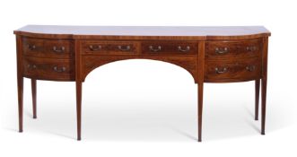 Arthur Brett & Sons, Norwich crossbanded mahogany serpentine fronted serving sideboard in George III