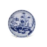 Large Lowestoft porcelain saucer with blue and white design of fence and flowering plants (ex-