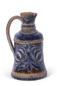 T Smith & Co Art pottery jug, the buff body decorated with incised foliage in blue, with similar