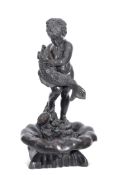 Large modern bronze garden sculpture of a cherub standing in a shell bowl holding a fish with a