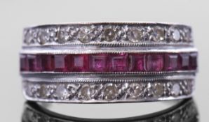 18ct white gold, ruby and diamond half hoop ring, the centre with a row of pave set calibre cut