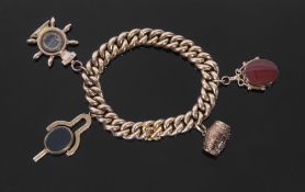 Antique heavy 15ct stamped curb link chain suspending various charms to include two swivel fobs,