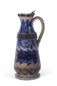 Smith & Co Art pottery jug with silver metal rim and cover, the body decorated with blue foliage and