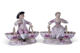 Pair of 19th century Meissen salts decorated in puce camieau with a boy and a girl holding floral
