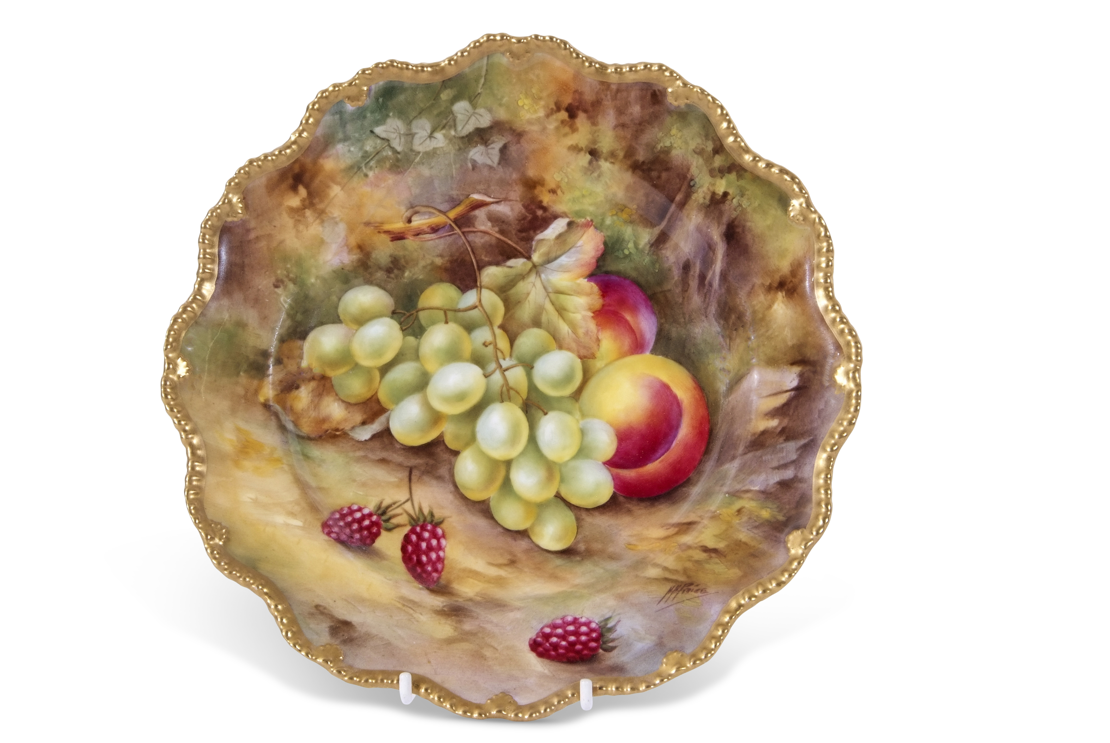 Royal Worcester plate decorated with fruit within a shaped gadrooned gilt rim, the plate signed by H