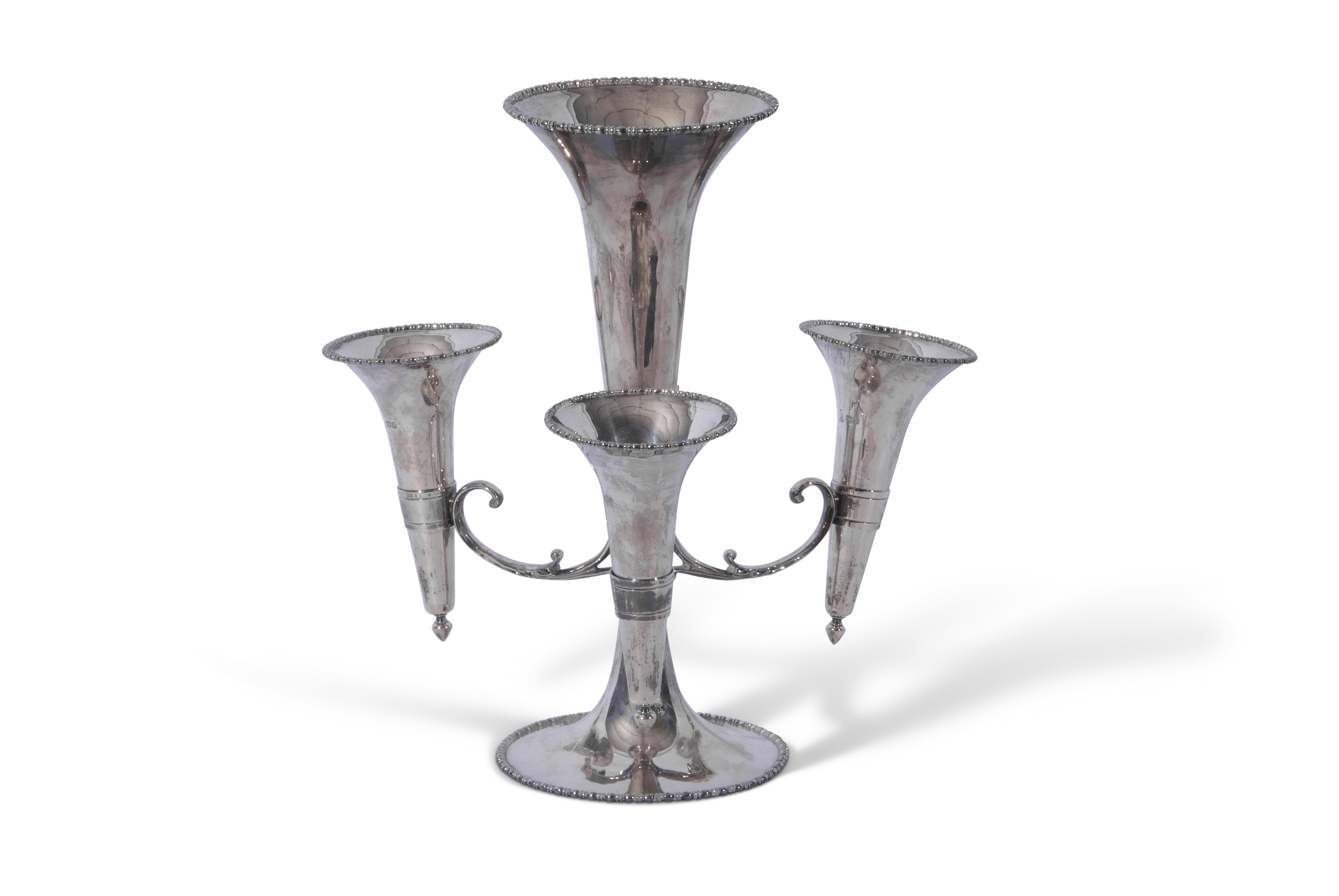 George V silver epergne with trumpet shaped central vase to a beaded circular foot, emitting three