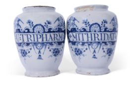 Pair of mid-18th century Delft jug jars with Latin in titles, the jars decorated with shells and