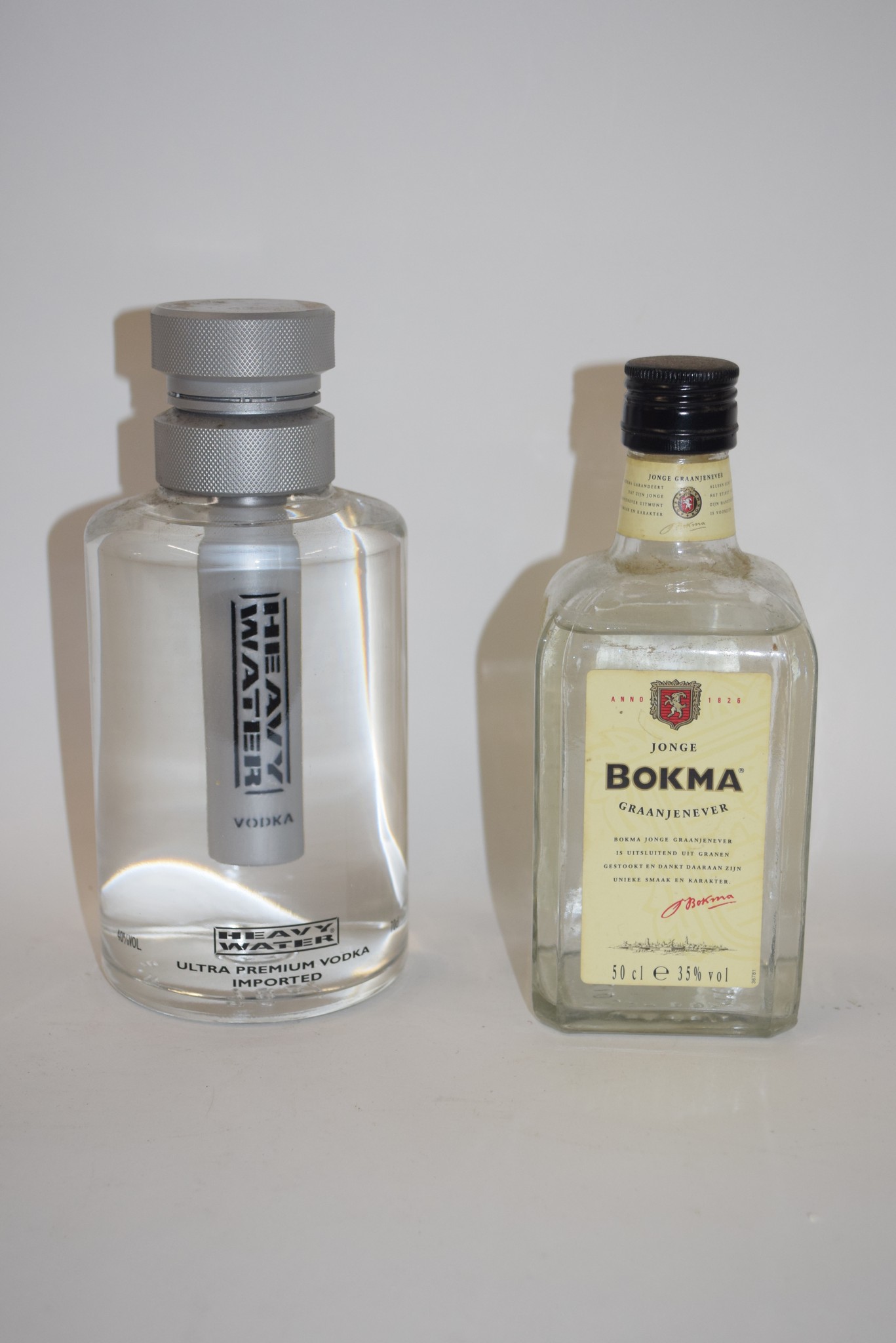 One bottle Heavy Water vodka, 70cl, 40% vol, together with one bottle of Bokma Graanjenever, 50cl,