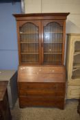 EARLY 20TH CENTURY OAK BUREAU BOOKCASE CABINET, THE TOP SECTION WITH TWO GLAZED DOORS OVER A BASE