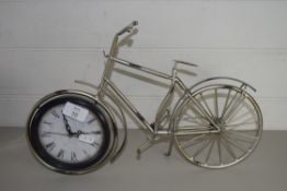 SMALL METAL MODEL OF A BICYCLE WITH CLOCK INSET TO FRONT WHEEL