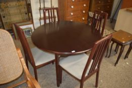 MODERN CIRCULAR MAHOGANY EFFECT DINING TABLE AND FOUR ACCOMPANYING CHAIRS BY THE MORRIS FURNITURE