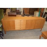 LARGE VINTAGE TEAK SIDEBOARD WITH THREE DOORS AND FIVE DRAWERS, BEARING LABEL TO INTERIOR "