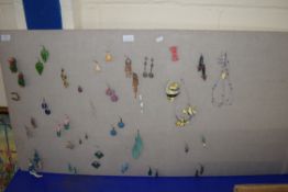 LARGE BOARD WITH QTY OF MAINLY COSTUME JEWELLERY EARRINGS ATTACHED