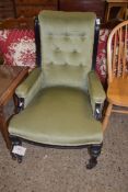 LATE VICTORIAN GREEN UPHOLSTERED ARMCHAIR WITH EBONISED FRAME