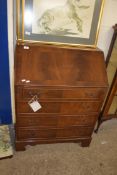 REPRODUCTION MAHOGANY BUREAU WITH FALL FRONT, FITTED INTERIOR OVER FOUR DRAWERS RAISED ON BRACKET