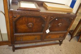 EARLY 20TH CENTURY OAK TWO-DOOR TWO-DRAWER SIDEBOARD WITH CARVED DETAIL, 122CM WIDE