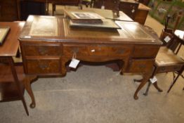 REPRODUCTION MAHOGANY VENEERED LEATHER TOPPED WRITING DESK WITH FIVE DRAWERS AND CABRIOLE LEGS,
