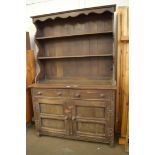20TH CENTURY OAK DRESSER CABINET WITH SHELVED BACK AND A BASE WITH TWO DRAWERS AND TWO DOORS,