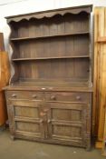 20TH CENTURY OAK DRESSER CABINET WITH SHELVED BACK AND A BASE WITH TWO DRAWERS AND TWO DOORS,