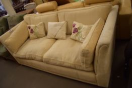 CREAM UPHOLSTERED THREE SEATER SOFA WITH LOOSE CUSHIONS