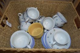 SEAGRASS BASKET CONTAINING FLORAL TEA WARES