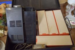 METAL CASE CONTAINING A SLIDE PROJECTOR AND VARIOUS SLIDES