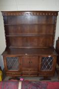 20TH CENTURY OAK DRESSER, THE SHELVED BACK WITH DRAWERS AND LEAD GLAZED DOORS, 126CM WIDE