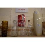 MIXED LOT: THREE DECANTERS, ART GLASS VASE AND A POTTERY VASE (5)