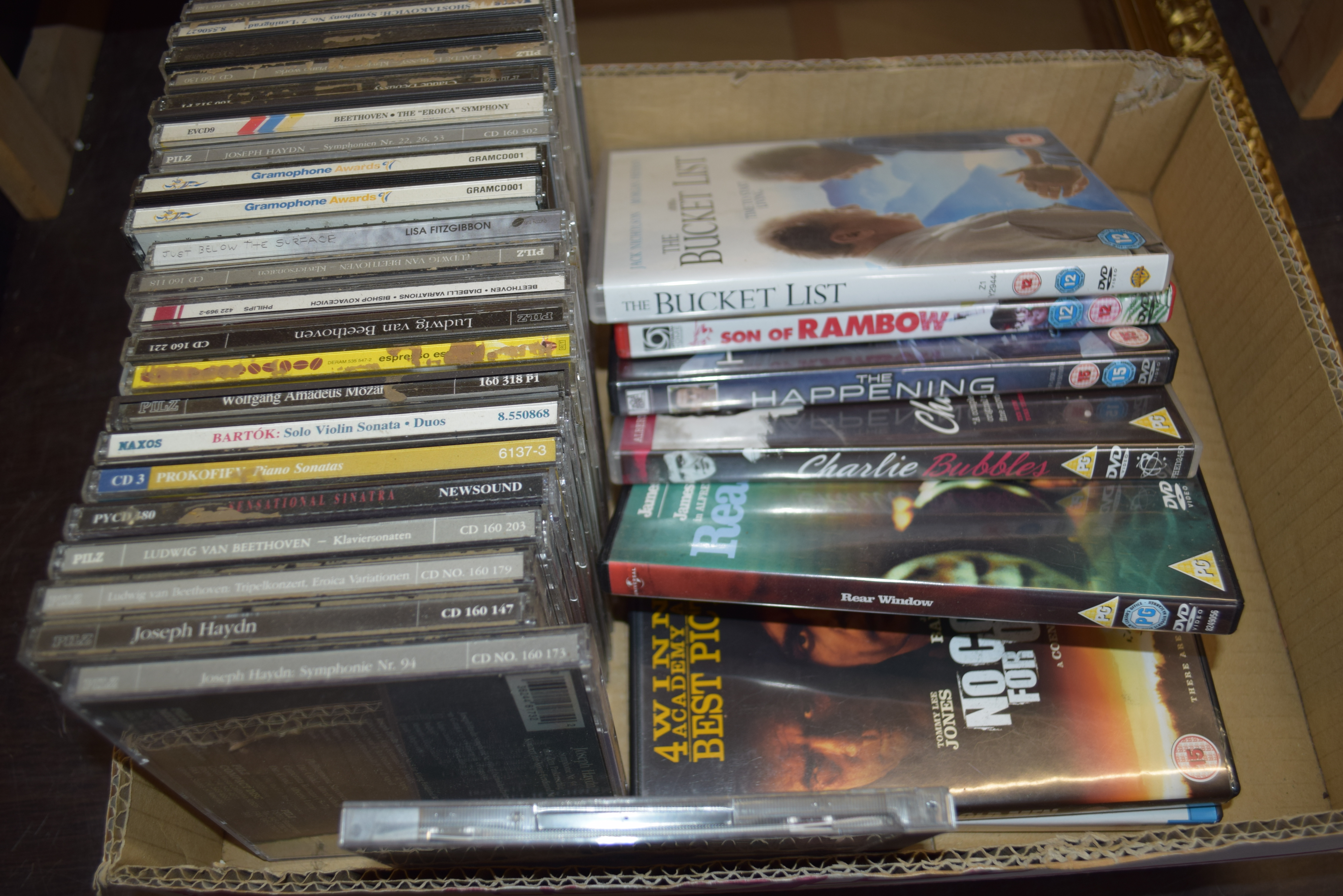 BOX OF MIXED CDS AND DVDS