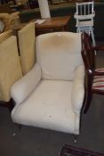 19TH CENTURY LARGE DEEP SEATED ARMCHAIR RAISED ON TURNED LEGS WITH CASTERS, SOLD FOR RE-UPHOLSTERY