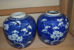 TWO CHINESE BLUE AND WHITE GINGER JARS DECORATED WITH PRUNUS FLOWERS
