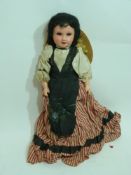 Late 19th century doll manufactured by S F B J marked to rear of head, child possibly in national