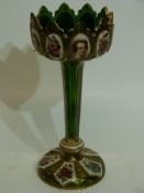 Table lustre, the green glass with alternating designs of flowers and figures, 27cm high