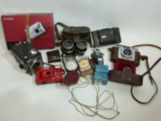 Box of miscellaneous cameras including a Zeiss Ikon, Kodak box brownie, Ilford Spectrum, plus