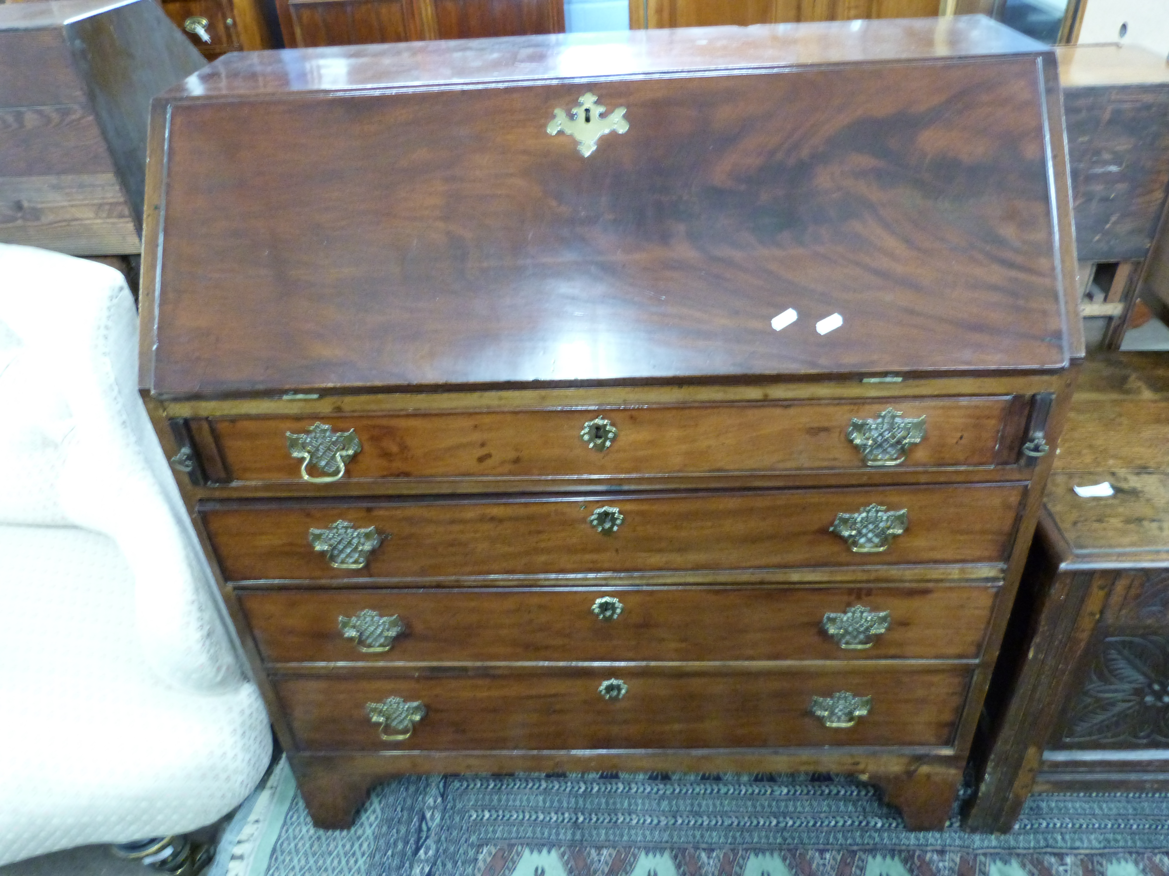 George III mahogany bureau with fall front opening to a fitted interior over three long drawers - Image 2 of 2