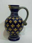 19th century Minton mask jug, the blue ground with a yellow design of flowers with yellow mask to