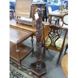 Late 19th/early 20th century turned hardwood torchere plant stand, the stem decorated with foliate