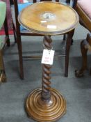 Late 19th century faded mahogany plant stand with barley twist column and circular stepped base,