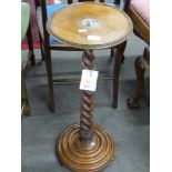 Late 19th century faded mahogany plant stand with barley twist column and circular stepped base,