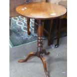 19th century mahogany tripod table with turned column raised on tripod base, 70cm high