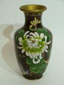 Cloisonne vase, the brown ground decorated with flowers in tones of green, 20cm high