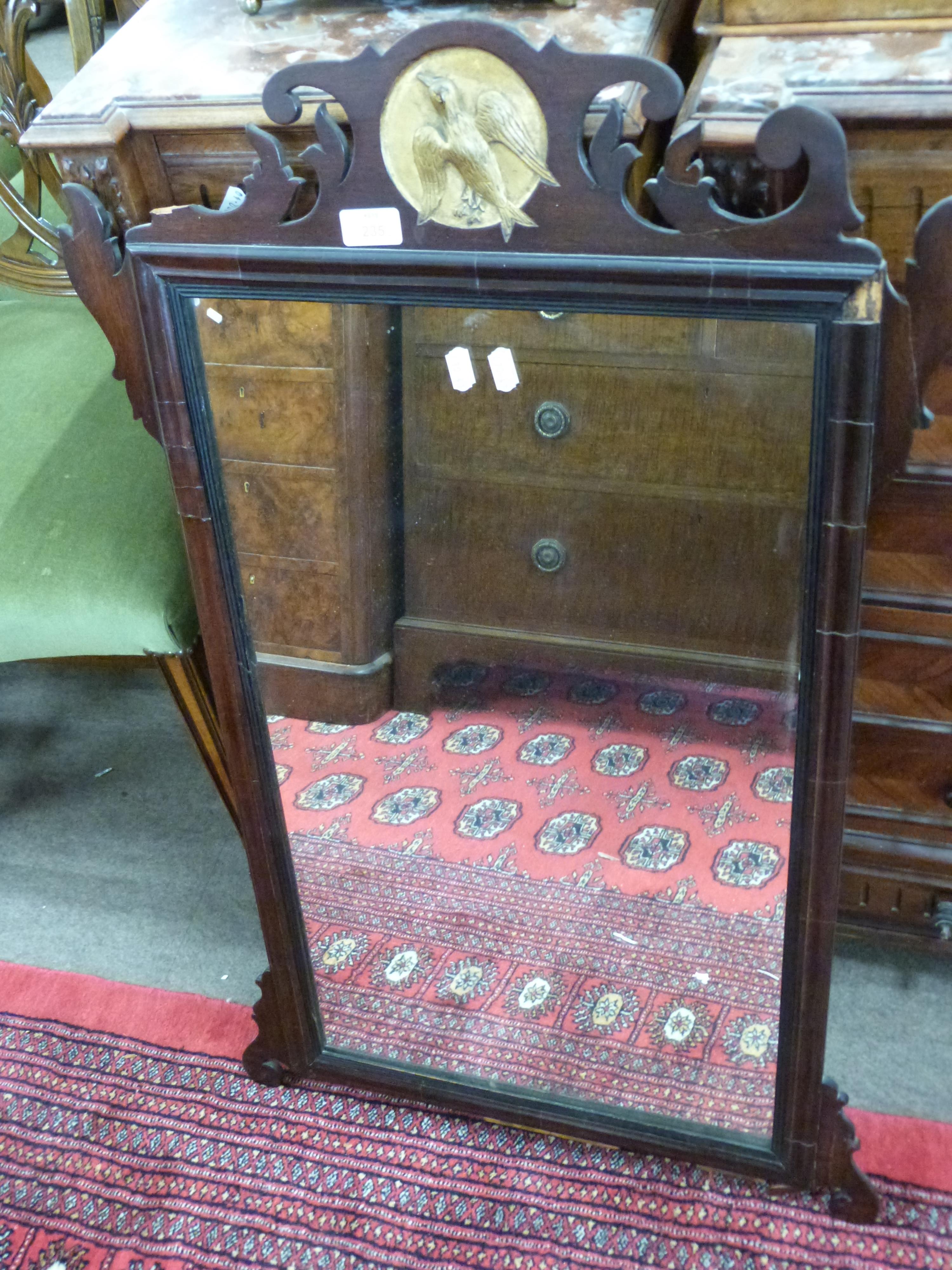 19th century wall mirror in mahogany fretwork frame with central gilded roundel detail with bird,