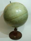 Globe on wooden mount, the circular base inset with a compass, the globe entitled "The Philips
