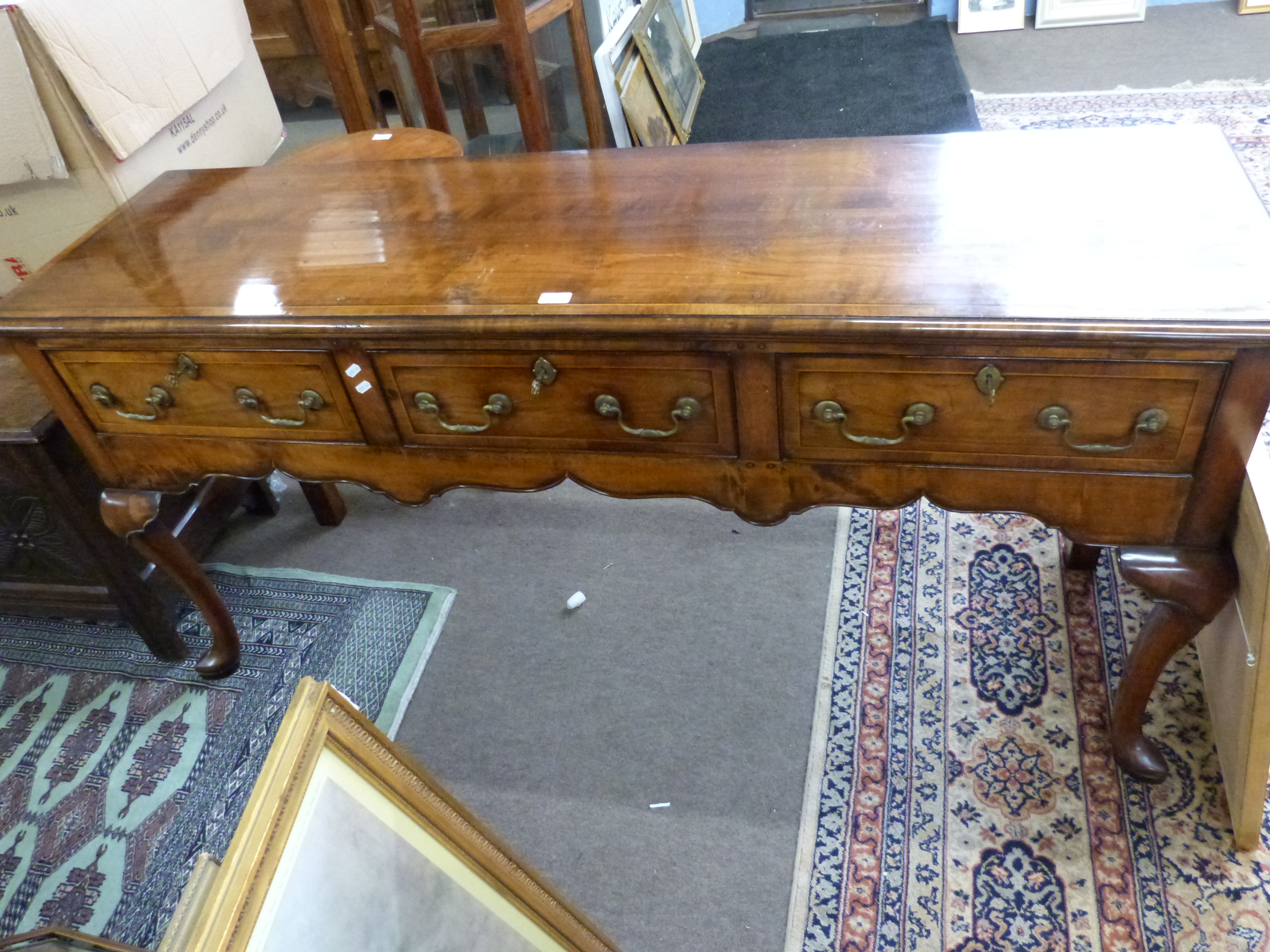 Good quality reproduction Georgian style dresser base fitted with three drawers with brass swan neck