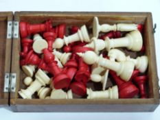 Collection of chess pieces in wooden box, ivory/bone, some stained red