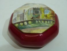 Royal Crown Derby trinket box of octagonal form, red base, the cover painted with a view of a