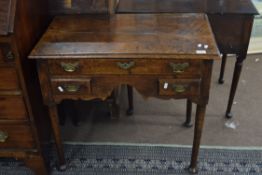 George III oak lowboy, fitted with one long and two short drawers, brass handles, raised on tapering